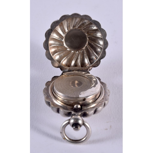 1023 - AN ANTIQUE WHITE METAL SHELL FORM SOVEREIGN CASE. 24.8 grams. 4.75 cm x 3.5 cm.