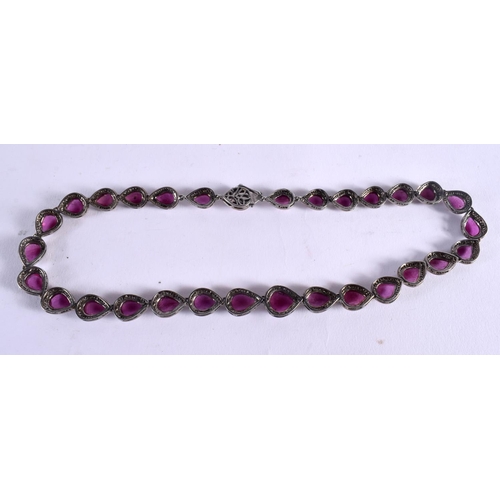 1041 - AN INDIAN DIAMOND AND RUBY NECKLACE. 47.7 grams. 46 cm long.