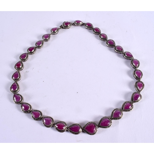 1041 - AN INDIAN DIAMOND AND RUBY NECKLACE. 47.7 grams. 46 cm long.