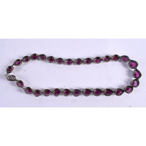 1041 - AN INDIAN DIAMOND AND RUBY NECKLACE. 47.7 grams. 46 cm long.