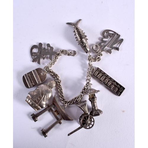 1045 - A CHINESE SILVER CHARM BRACELET. 48 grams. 19.5 cm long.