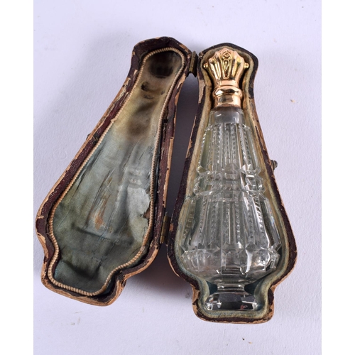 1049 - AN 18CT GOLD MOUNTED GLASS SCENT BOTTLE. 49 grams. 11 cm x 3.75 cm.