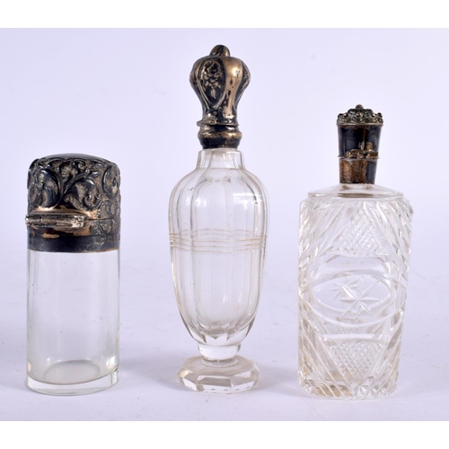 1069 - THREE ANTIQUE SILVER SCENT BOTTLES. 180 grams overall. Largest 11 cm x 3 cm. (3)