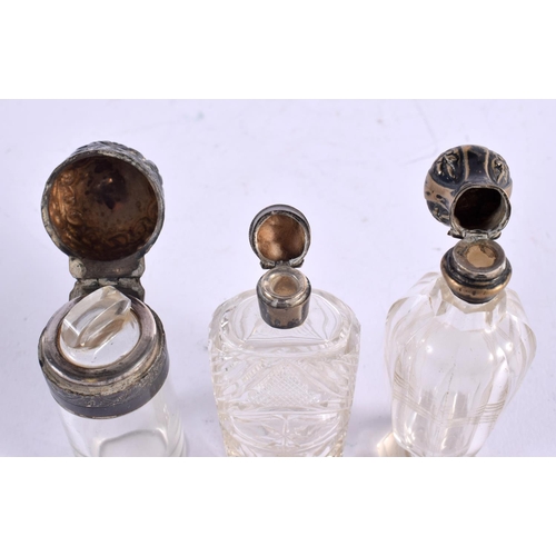 1069 - THREE ANTIQUE SILVER SCENT BOTTLES. 180 grams overall. Largest 11 cm x 3 cm. (3)