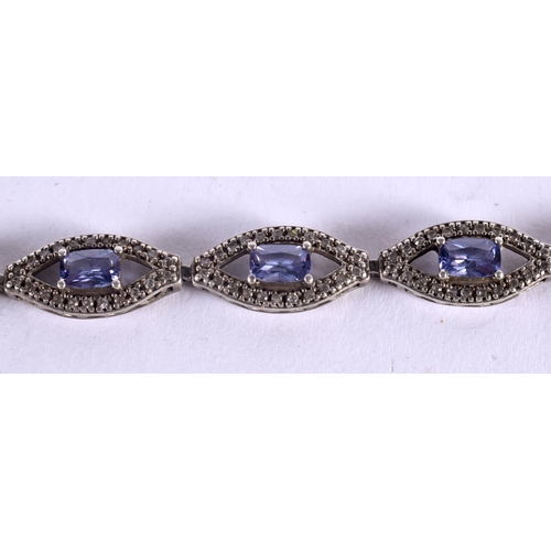 1080 - A SILVER AND TANZANITE BRACELET. 15 grams. 19 cm long.