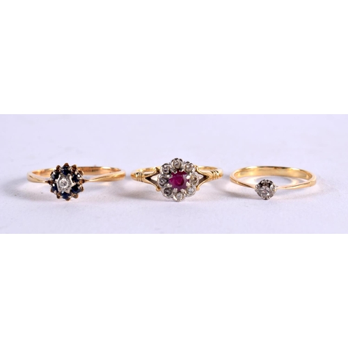 1110 - AN 18CT GOLD DIAMOND AND RUBY RING together with two other gold and diamond rings. 7.6 grams. M, P &... 