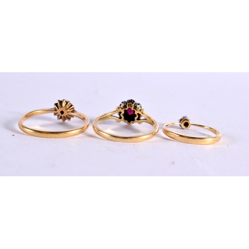 1110 - AN 18CT GOLD DIAMOND AND RUBY RING together with two other gold and diamond rings. 7.6 grams. M, P &... 