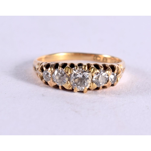 1112 - A GOLD AND FIVE STONE DIAMOND RING. 3 grams. M.