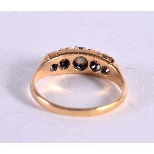 1112 - A GOLD AND FIVE STONE DIAMOND RING. 3 grams. M.