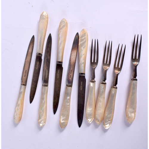 1128 - ART DECO SILVER AND MOTHER OF PEARL FLATWARE together with a pair of candlesticks. Flatware Sheffiel... 