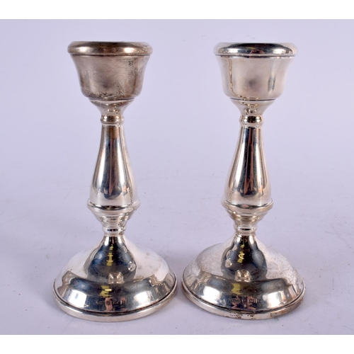 1138 - THREE PAIRS OF SILVER CANDLESTICKS. London 1887, Chester 1911 & Birmingham 1970. 1740 grams overall.... 