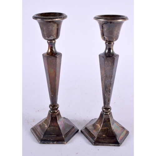 1138 - THREE PAIRS OF SILVER CANDLESTICKS. London 1887, Chester 1911 & Birmingham 1970. 1740 grams overall.... 