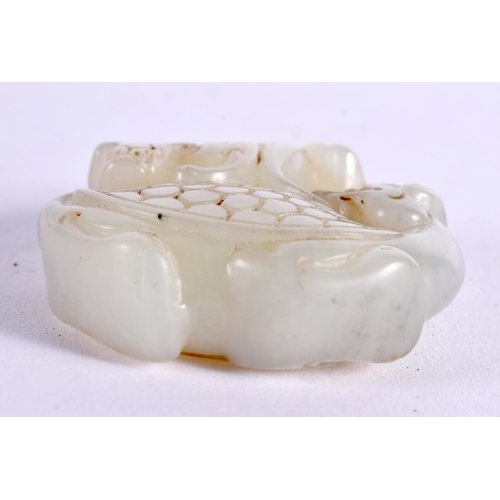 1139 - A CHINESE CARVED JADE ROUNDEL 20th Century. 5 cm wide.