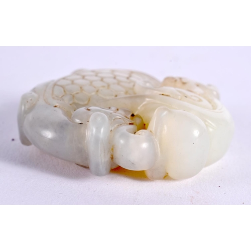 1139 - A CHINESE CARVED JADE ROUNDEL 20th Century. 5 cm wide.