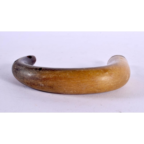 1143 - A 19TH CENTURY MIDDLE EASTERN CARVED RHINOCEROS HORN CANE HANDLE. 82 grams. 12 cm x 8 cm.