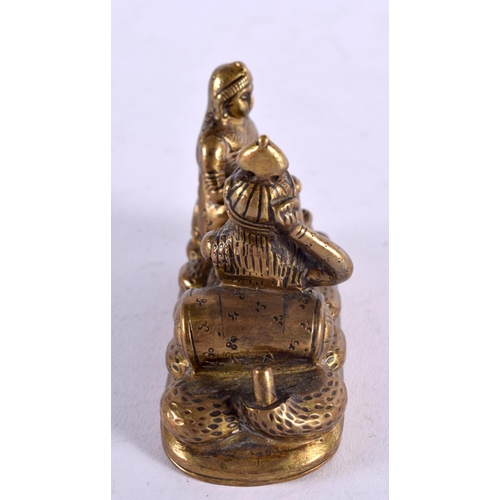 1145 - AN ANTIQUE INDIAN BRONZE FIGURAL GROUP depicting a female massaging a male. 8 cm x 5 cm.