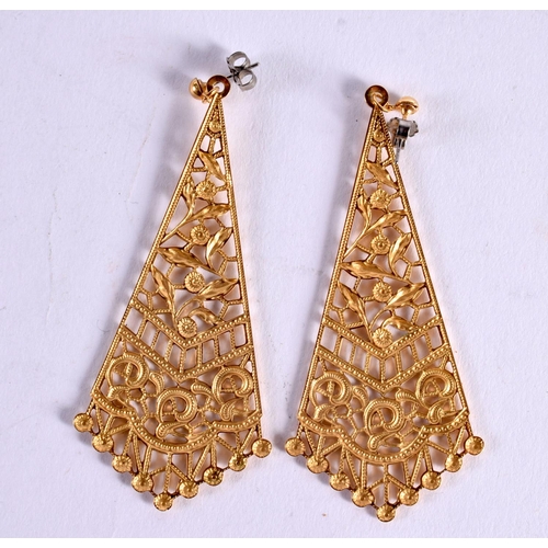 1159 - A PAIR OF MIDDLE EASTER YELLOW METAL EARRINGS possibly high carat gold. 7.7 grams. 7 cm x 3 cm.