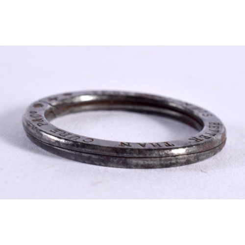 1177 - AN UNUSUAL ANTIQUE PREVENTION IS BETTER THAN CURE RING. 10.4 grams. 4 cm diameter.