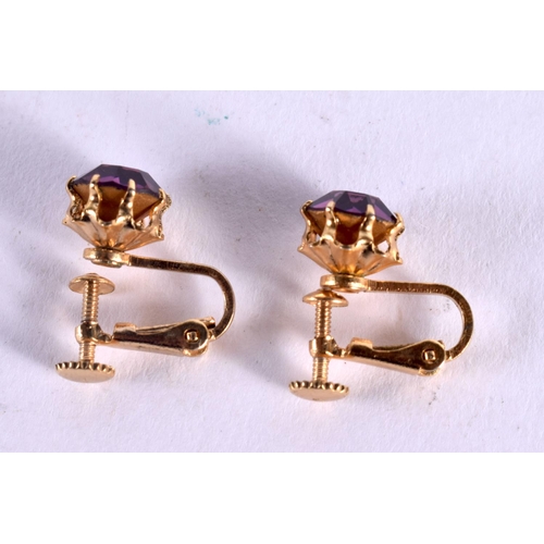 1180 - A PAIR OF VINTAGE YELLOW METAL GEM SET AMETHYST EARRINGS. 3.2 grams. 2 cm x 1.5 cm.