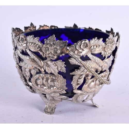 1188 - AN UNUSUAL ANTIQUE WHITE METAL BRISTOL BLUE SUGAR BASKET. Metal 111 grams. 15 cm x 11 cm inc handle.