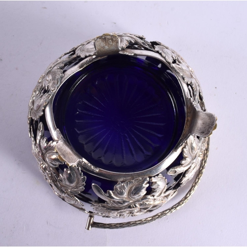 1188 - AN UNUSUAL ANTIQUE WHITE METAL BRISTOL BLUE SUGAR BASKET. Metal 111 grams. 15 cm x 11 cm inc handle.