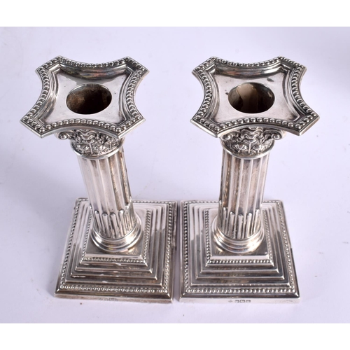 1196 - A PAIR OF EDWARDIAN SILVER CANDLESTICKS. Birminghan 1905. 1077 grams overall. 18 cm x 7 cm.