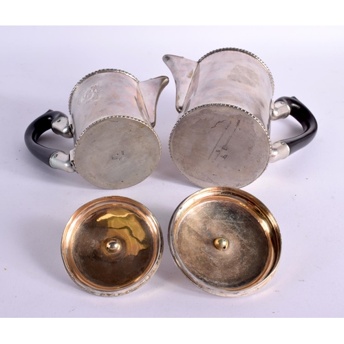 1221 - TWO UNUSUAL ANTIQUE CONTINENTAL SILVER COFFEE POTS. 871 grams. Largest 19 cm x 16 cm. (2)