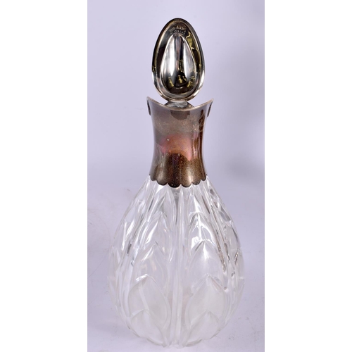 1240 - AN EDWARDIAN SILVER AND CRYSTAL GLASS CLARET JUG. London 1900. 871 grams overall. 25 cm x 13 cm.