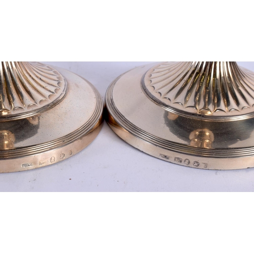 1246 - A MATCHED PAIR OF EARLY 19TH CENTURY ENGLISH SILVER CANDLESTICKS. 1435 grams overall. 30 cm x 15 cm.