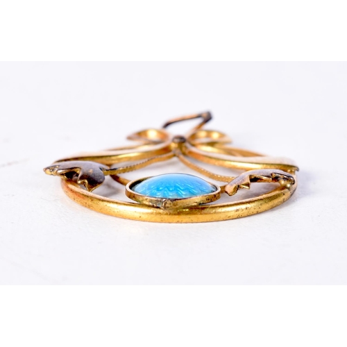 1269 - AN ART NOUVEAU YELLOW METAL AND ENAMEL BROOCH. 1.9 grams. 3 cm x 2.5 cm.