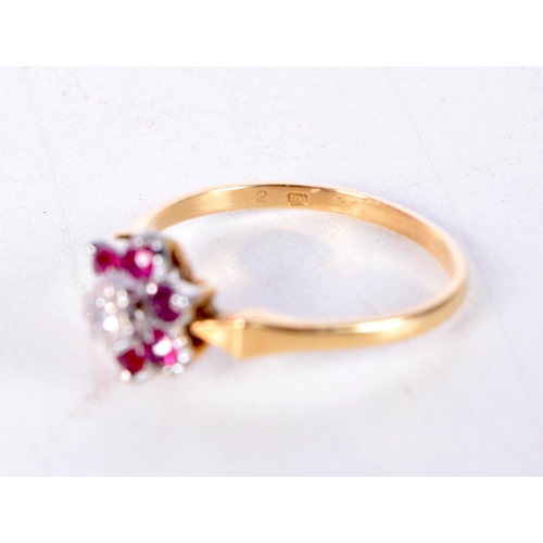 1270 - AN 18CT GOLD DIAMOND AND RUBY RING. 2.3 grams. N.