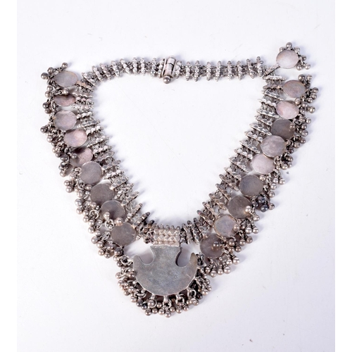 1297 - A MIDDLE EASTERN BEDOUIN SILVER NECKLACE. 201 grams. 45 cm long.