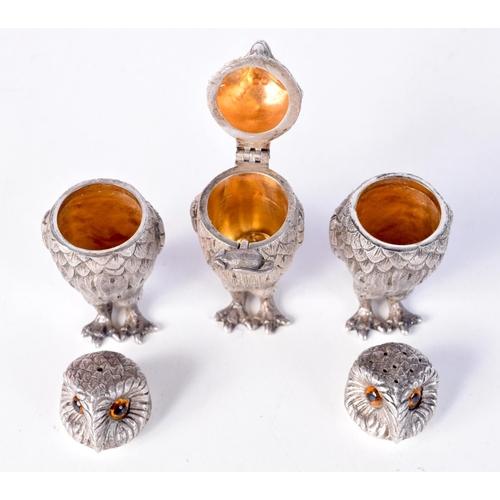 1299 - A SET OF THREE SILVER GARRARD OWL CONDIMENTS. London 1975 & 1981. 355 grams. 7 cm x 3.5 cm. (3)