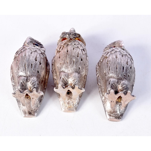 1299 - A SET OF THREE SILVER GARRARD OWL CONDIMENTS. London 1975 & 1981. 355 grams. 7 cm x 3.5 cm. (3)