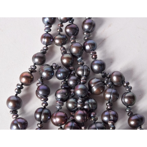 1306 - A PEARL NECKLACE. 105 grams. 177 cm long.