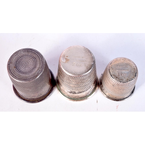 1343 - TWO SILVER THIMBLES. 99 grams. Largest 5 cm x 4.75 cm. (2)