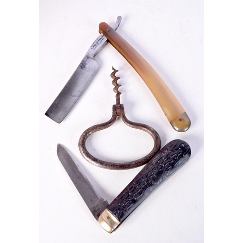 1373 - TWO KNIVES and a corkscrew. Largest 25 cm long. (3)