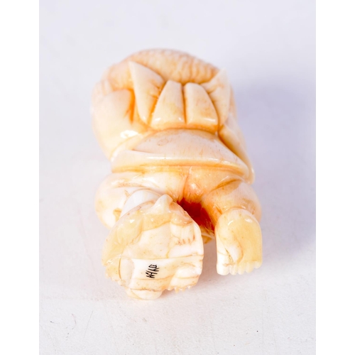 1385 - A JAPANESE CARVED BONE FISHERMAN NETSUKE. 32 grams. 5 cm x 2.75 cm.