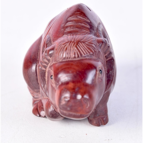 1386 - A JAPANESE CARVED WOOD BULL OKIMONO. 6.25 cm x 3.25 cm.