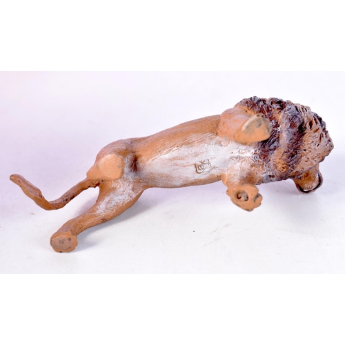 1409 - COLD PAINTED BRONZE LION. 6.7cm x 10.3cm x 4.1cm