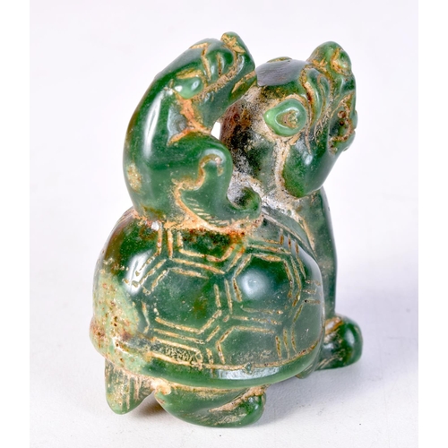 1414 - A CHINESE JADE FIGURE OF SPITTOR RIDING A DRAGON TURTLE. 6cm x 4.5cm x 3.5cm