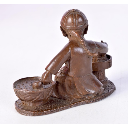 1415 - A JAPANESE BRONZE MODELLED AS A SEATED MALE PREPARING FOOD. 6cm x 7.6cm x 3.3cm