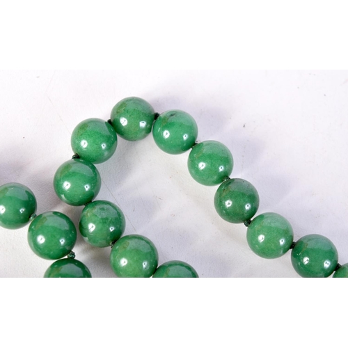 1425 - A STRING OF GREEN HARDSTONE BEADS. 84cm long, Beads 11.6mm, weight 154g