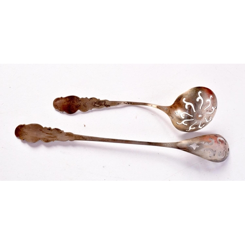 1426 - TWO SILVER GILT AND ENAMEL STRAINER SPOONS. Stamped Sterling, Longest 17cm, total weight 28g (2)