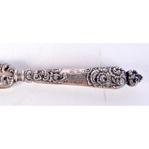 1450 - A SILVER HANDLED LETTER OPENER WITH A MOTHER OF PEARL BLADE IN THE FORM OF AN ARABIAN SWORD. Stamped... 