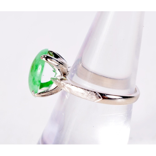 1456 - A 14CT WHITE GOLD RING WITH A JADE SOLITAIRE SETTING. Stamped 14K, Size J/K, weight 3.2g