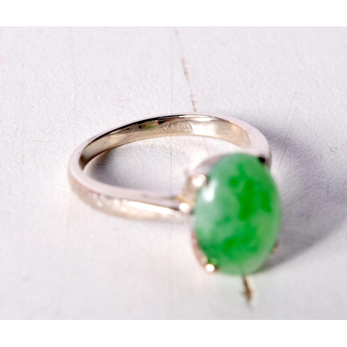 1456 - A 14CT WHITE GOLD RING WITH A JADE SOLITAIRE SETTING. Stamped 14K, Size J/K, weight 3.2g