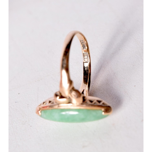 1457 - A 14CT GOLD RING WITH A JADE SOLITAIRE SETTING. Stamped 14K, Size L, weight 3g