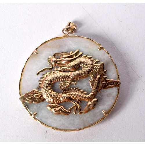 1467 - A 14CT GOLD MOUNTED FAT BUDDHA PENDANT THE REVERSE DECORATED WITH A GOLD DRAGON. Stamped 14K, 5.6cm ... 