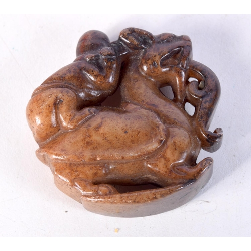 1477 - A CHINESE JADE ROUNDEL. 5 cm wide.